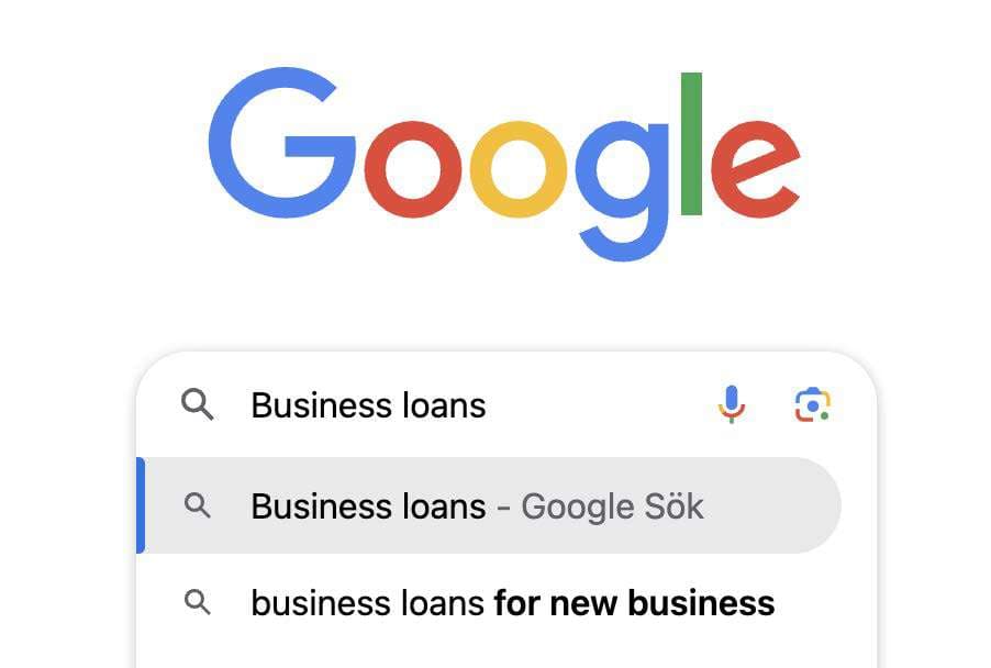 Google search bar showing a "Business loans" query and autocomplete suggestions